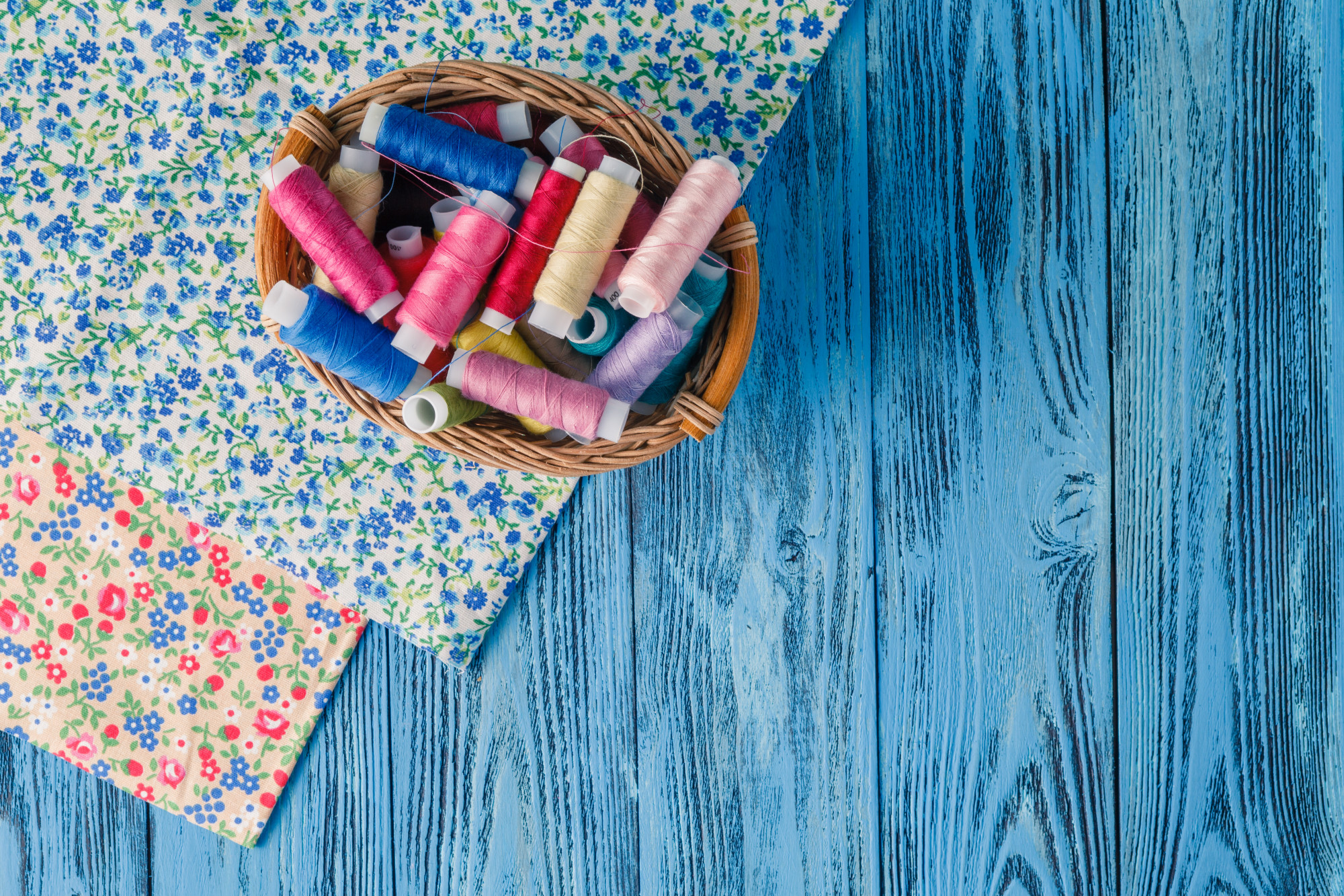 Stack of embroidered samples laid out on table